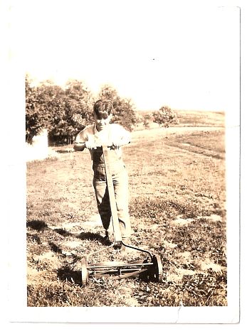 1936.. - Robert - hand-mowing in the parking lot.jpg